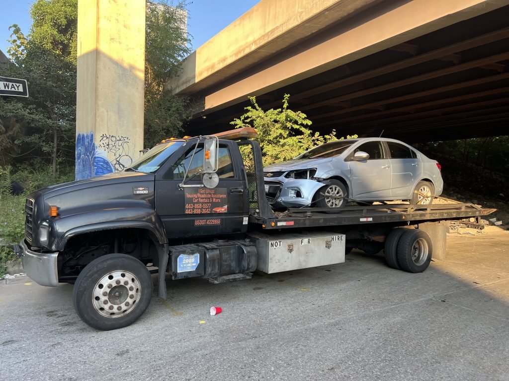 I Got Whipz Towing & Roadside Assistance with a blue chevy cruze sedan towing near me from 39.268927, -76.633783 to 725 Stamford rd Baltimore, MD 21229
