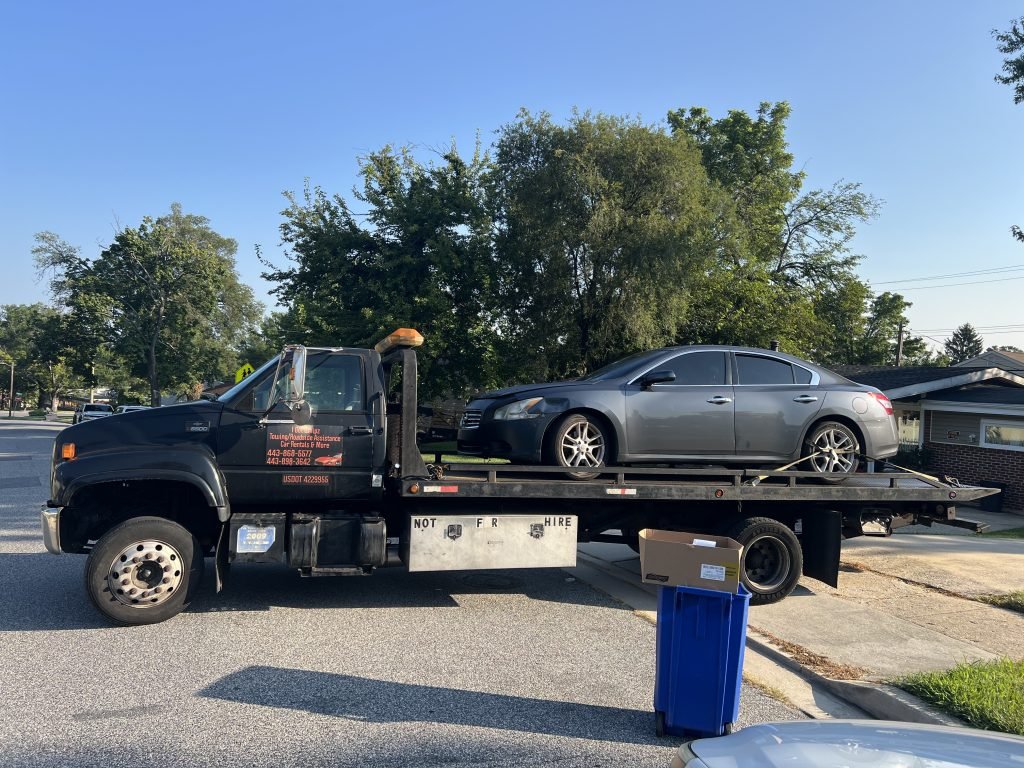 I Got Whipz Towing & Roadside Assistance with a grey nissan altima sedan towing near me from 7001 Paris Rd, Gwynn Oak, MD 21207 to 7030 Liberty Rd, Gwynn Oak, MD 21207