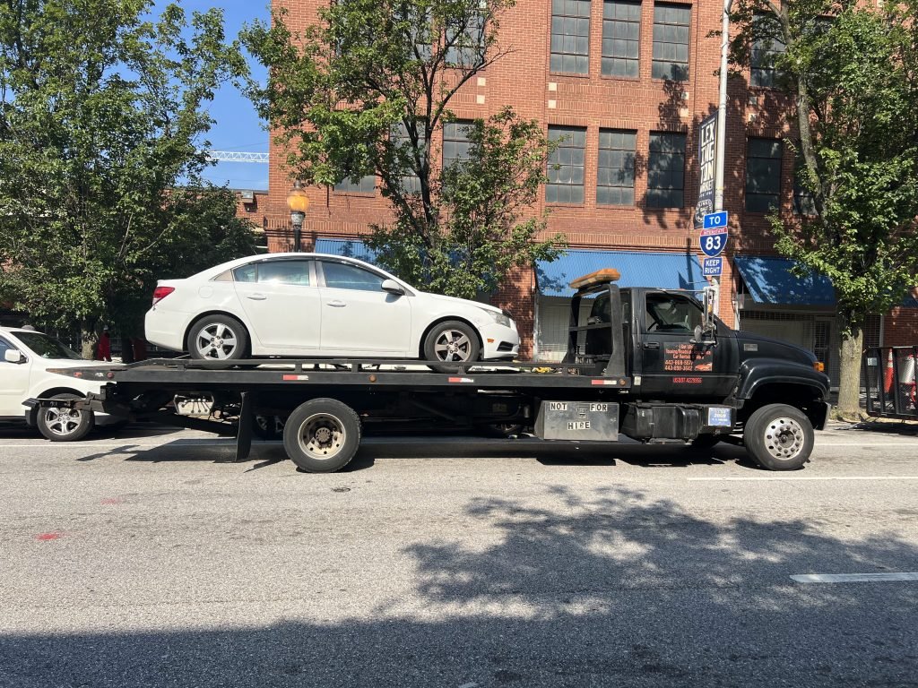 I Got Whipz Towing & Roadside Assistance with a white chevy cruze sedan towing near me from 39.292209, -76.622575 to 3600 Bowers Ave, Baltimore, MD 21207