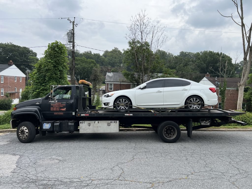 I Got Whipz Towing & Roadside Assistance with a white kia cadenza sedan towing near me from 4400 Wakefield rd Baltimore,MD 21216 to 6611 Security Blvd, Woodlawn, MD 21207