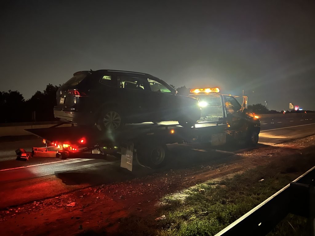 I Got Whipz Towing & Roadside Assistance with a black volkswagen Tiguan suv towing near me from 39.31156 -76.74470 to 3497 Hillsmere Rd Gwynn Oak Maryland 21207