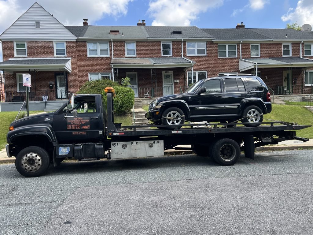 I Got Whipz Towing & Roadside Assistance with a blk jeep liberty truck towing near me from 1450 Pentwood rd Baltimore, MD 21239 to 6800 Huntington Dr Gwynn Oak, MD 21207