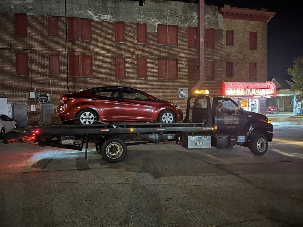 I Got Whipz Towing & Roadside Assistance with a red hyundai elantra sedan towing near me from 3826 Liberty Heights Ave, Baltimore, MD 21215 to 3000 Mayfair Rd, Gwynn Oak, MD 21207