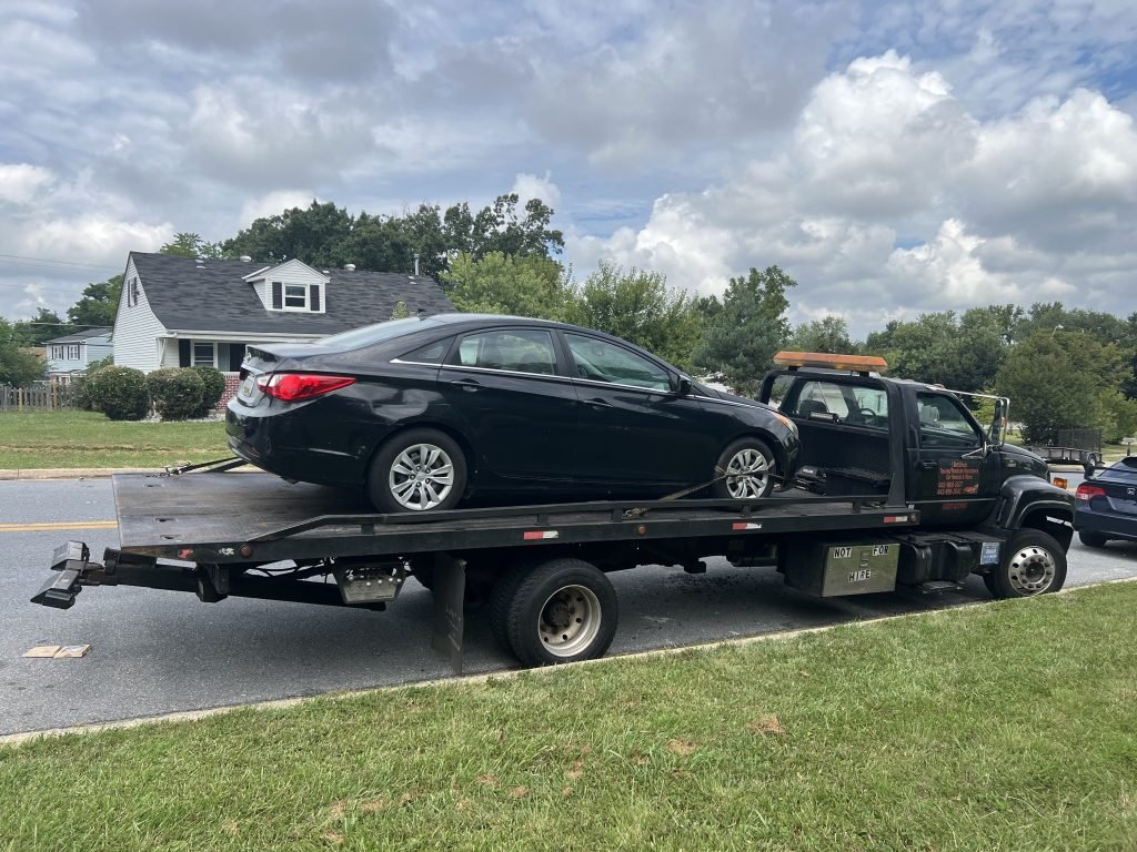 I Got Whipz Towing & Roadside Assistance with a black hyundai sonata sedan towing near me from 1938 Greengage Rd Woodlawn, Maryland to 39.285372, -76.741717