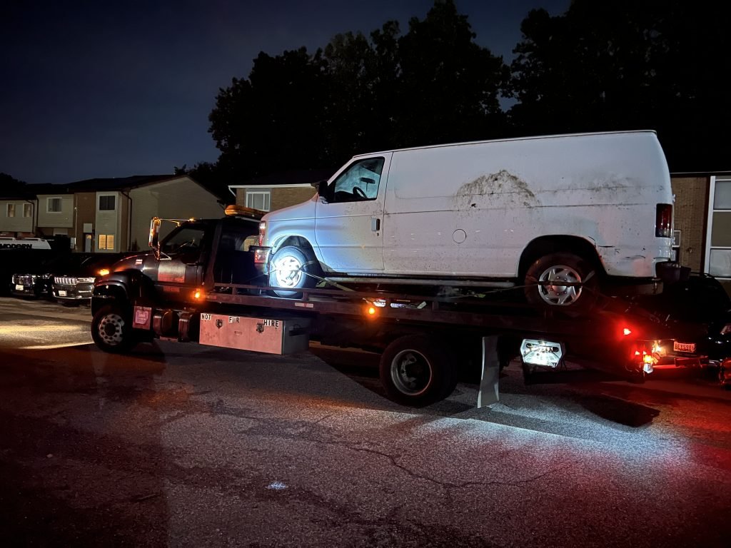 I Got Whipz Towing & Roadside Assistance with a commercial white ford cargo van towing near me from 6500 Woodgreen cir Gwynn Oak, MD 21207 to 3203 Elgin Avenue Baltimore, MD 21216