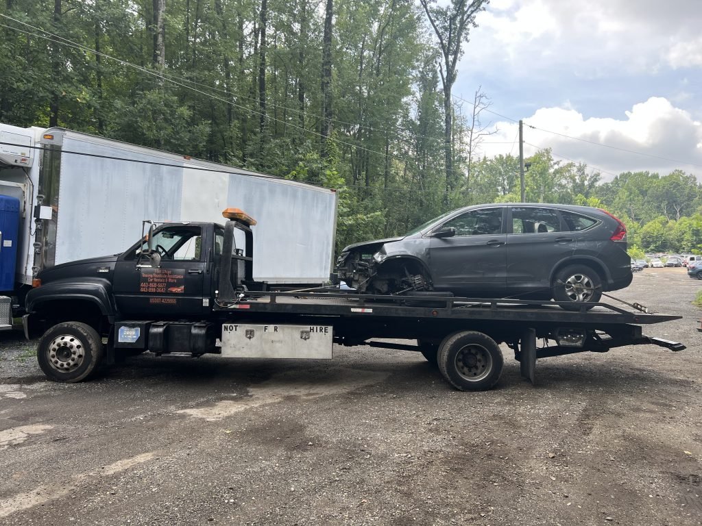 I Got Whipz Towing & Roadside Assistance with a grey honda cr-v suv towing near me from 928 Batavia Farm Rd Rosedale, MD 21237 to 600 W Franklin St, Baltimore, MD 21201