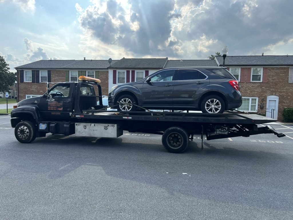 I Got Whipz Towing & Roadside Assistance with a grey chevy equinox suv towing near me from 4000 Milford Mill, MD 21244 to 4130 Emmart Ave, Baltimore, MD 21215