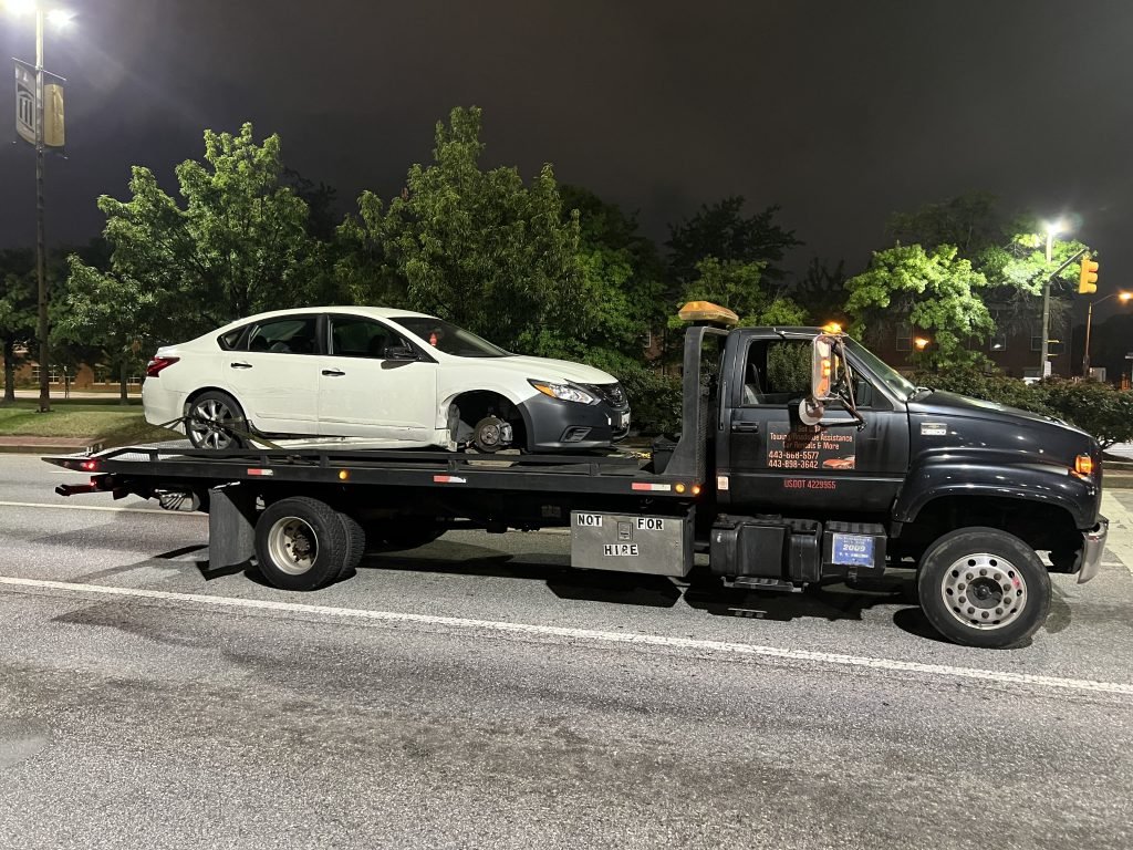 I Got Whipz Towing & Roadside Assistance with a white nissan altima sedan towing near me from 1251 Washington Blvd, Baltimore, MD 21230 to 3800 Hamilton ave Baltimore, MD 21214