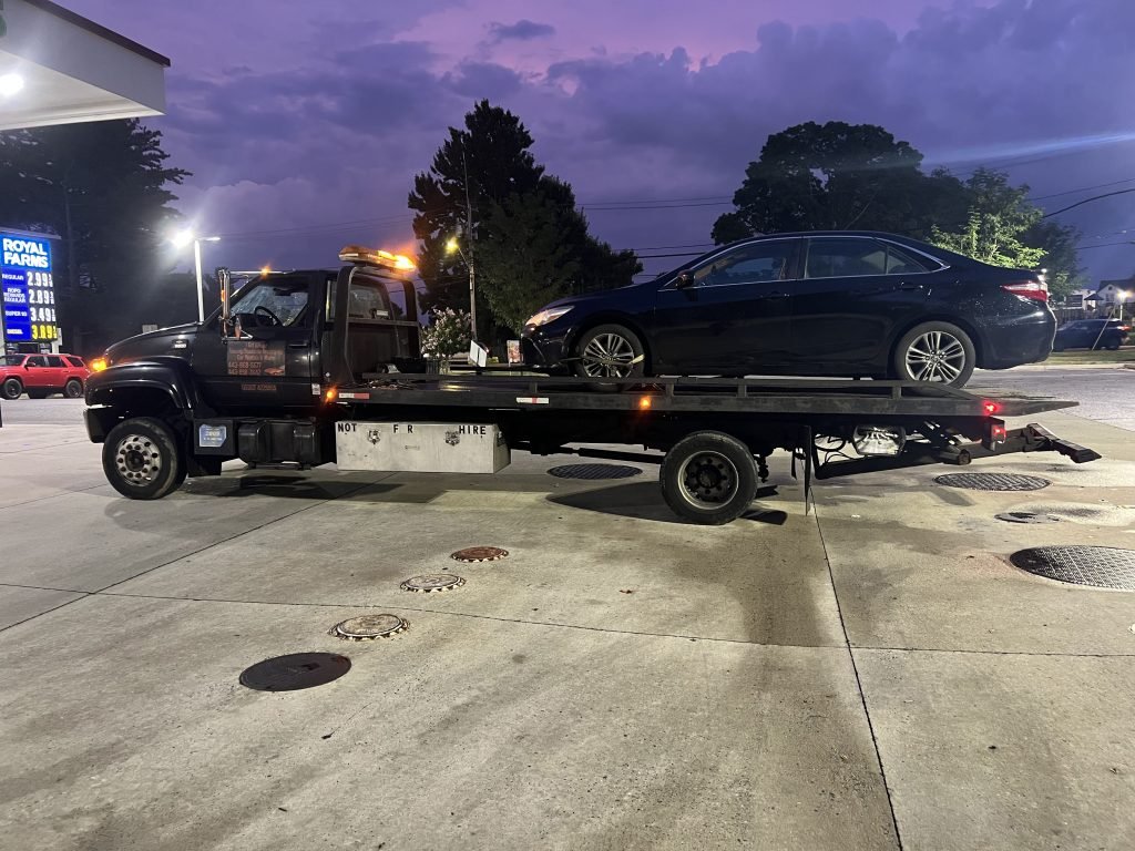 I Got Whipz Towing & Roadside Assistance with a black toyota camry sedan towing near me from 2000 N Forest Park Ave, Baltimore, MD 21207 to 6324 Baltimore National Pike, Baltimore, MD 21228