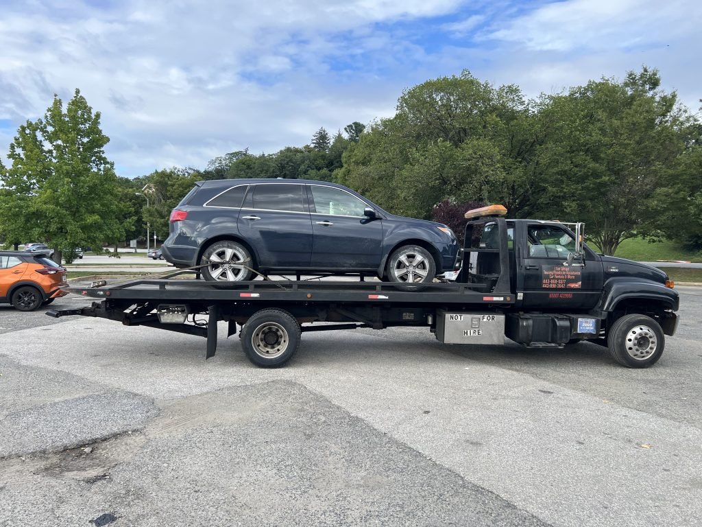 I Got Whipz Towing & Roadside Assistance with a blue acura mdx suv towing near me from 4600 Falls Rd, Baltimore, MD 21209 to 825 Dulaney Valley Road, Towson, MD 21204
