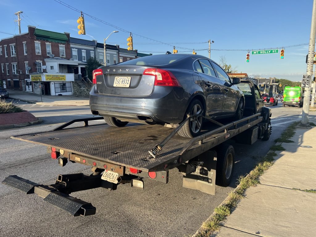 I Got Whipz Towing & Roadside Assistance with a blue volvo sedan sedan towing near me from 3805 Edmondson Ave Baltimore,MD 21229 to 4411 E.Monument st Baltimore, MD 21205