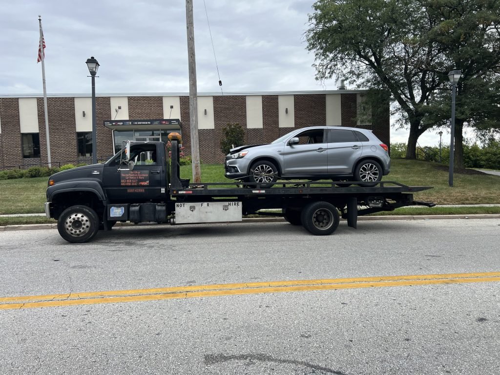 I Got Whipz Towing & Roadside Assistance with a grey Mitsubushi outlander suv towing near me from 1705 Whitehead rd Woodland, MD 21244 to 4178 W Belvedere Ave Baltimore, MD 21215