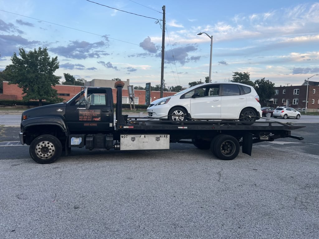 I Got Whipz Towing & Roadside Assistance with a white honda fit sedan towing near me from 3601 Potee St, Brooklyn, MD 21225 to 1664 Kirkwood Rd, Baltimore, MD 21207