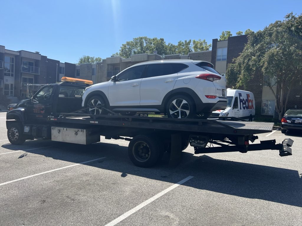 I Got Whipz Towing & Roadside Assistance with a white hyundai Tuscon suv towing near me from 6 Duke of Windsor Ct to 4007 emmart ave Baltimore,MD 21215
