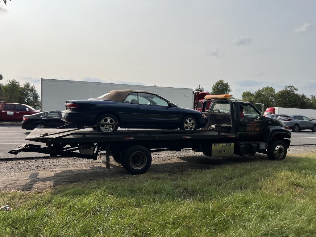 I Got Whipz Towing & Roadside Assistance with a blue chrysler sebring coupe towing near me from 39°18'51.4"N 76°44'39.5"W to 2904 Knoll Acres Dr Parkville,MD 21234