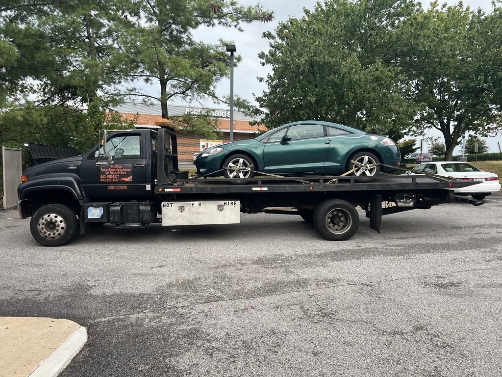 I Got Whipz Towing & Roadside Assistance with a green mitsubishi eclipse coupe towing near me from 2 1601 Belmont Ave, Baltimore, MD 21244 to 223 E Green St, Westminster, MD 21157