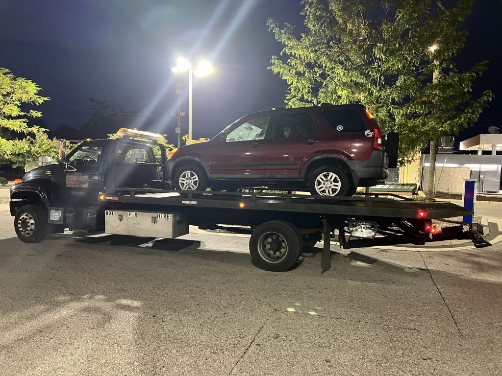 I Got Whipz Towing & Roadside Assistance with a burgundy honda CR-V truck towing near me from 39°18'25.3"N 76°46'30.1"W to 2000 N Forest Park Ave, Baltimore, MD 21207