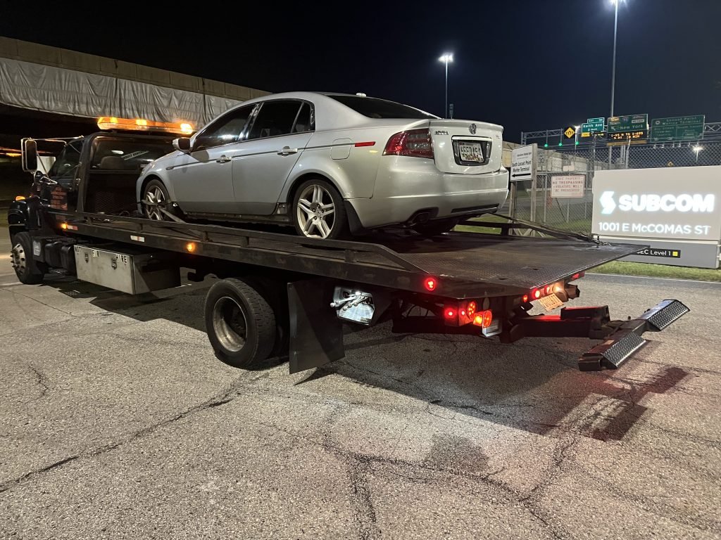 I Got Whipz Towing & Roadside Assistance with a grey acura tl sedan towing near me from 1001 E Mccomas st Baltimore, MD 21230 to 5500 Belair Rd, Baltimore, MD 21206