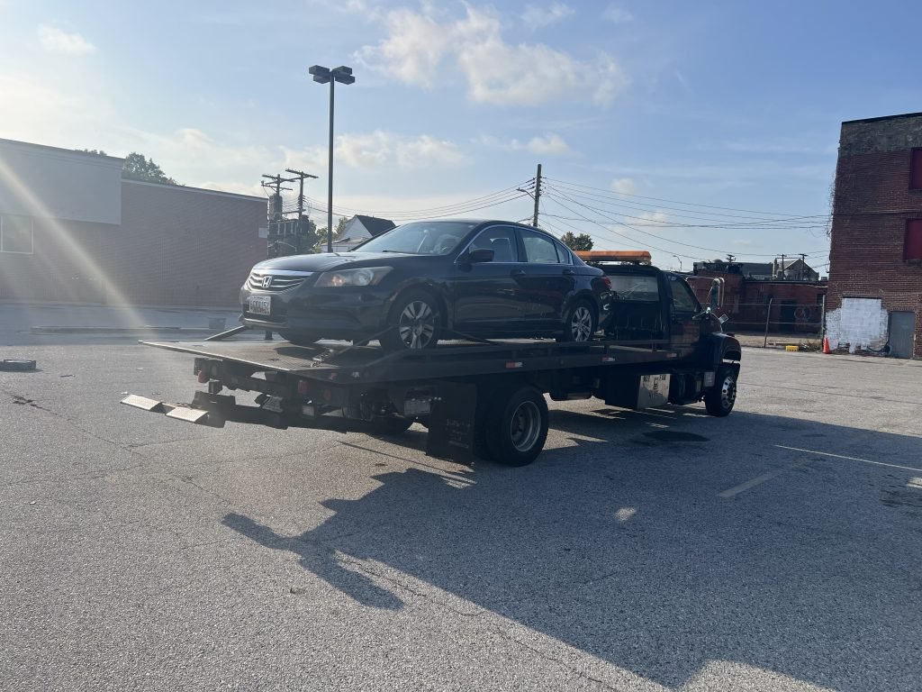 I Got Whipz Towing & Roadside Assistance with a grey honda accord sedan towing near me from 3343 Garrison Blvd, Baltimore, MD 21216 to 1901 Wilkens Ave, Baltimore, MD 21223