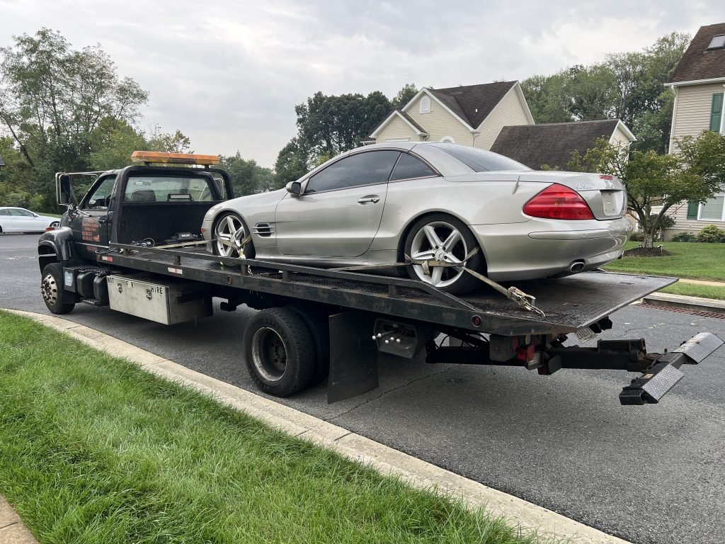 I Got Whipz Towing & Roadside Assistance with a grey mercedes-bens sl500 coupe towing near me from 2601 Poplar Dr, Woodlawn, MD 21207 to 3300 E Fayette St, Baltimore, MD 21224