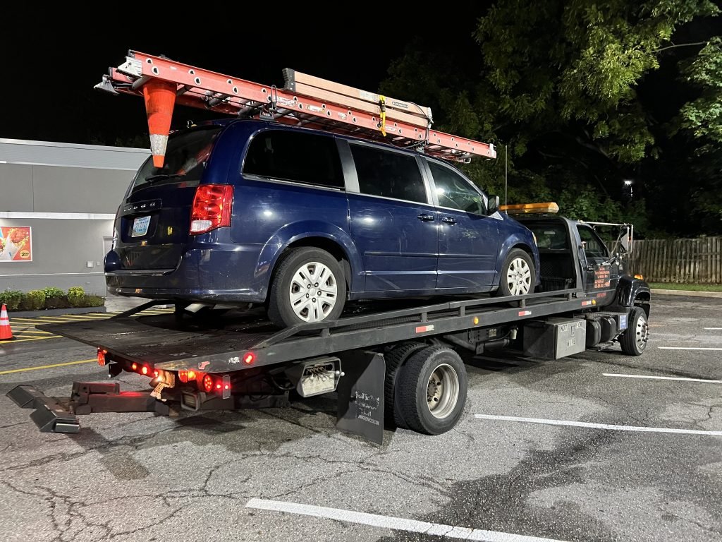 I Got Whipz Towing & Roadside Assistance with a blue dodge caravan towing near me from 6000 Liberty Rd, Gwynn Oak, MD 21207 to 6700 Townbrook dr Lochearn, MD 21207