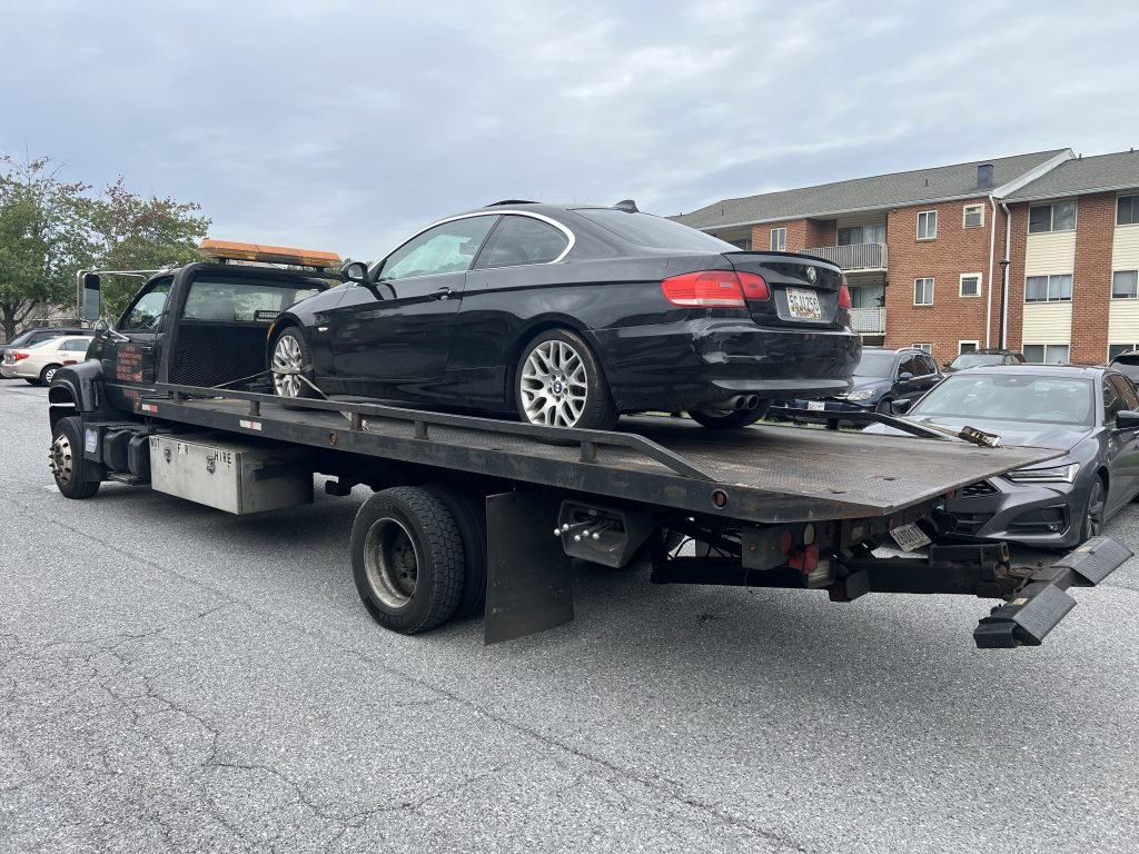I Got Whipz Towing & Roadside Assistance with a black bmw 3 series coupe towing near me from 2 Stockmill Rd, Pikesville, MD 21208 to 5218 Fairlawn Ave, Baltimore, MD 21215