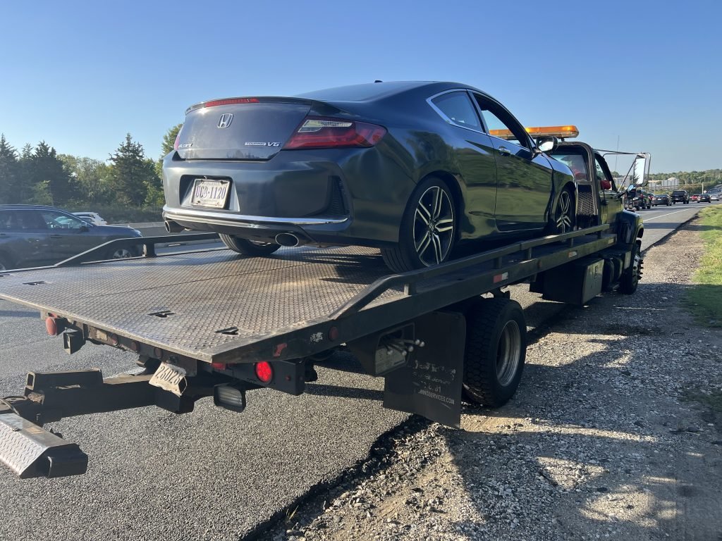 I Got Whipz Towing & Roadside Assistance with a black honda accord coupe towing near me from 39.3151217,-76.7445289 to 604 St Agnes Ln, Baltimore, MD 21229