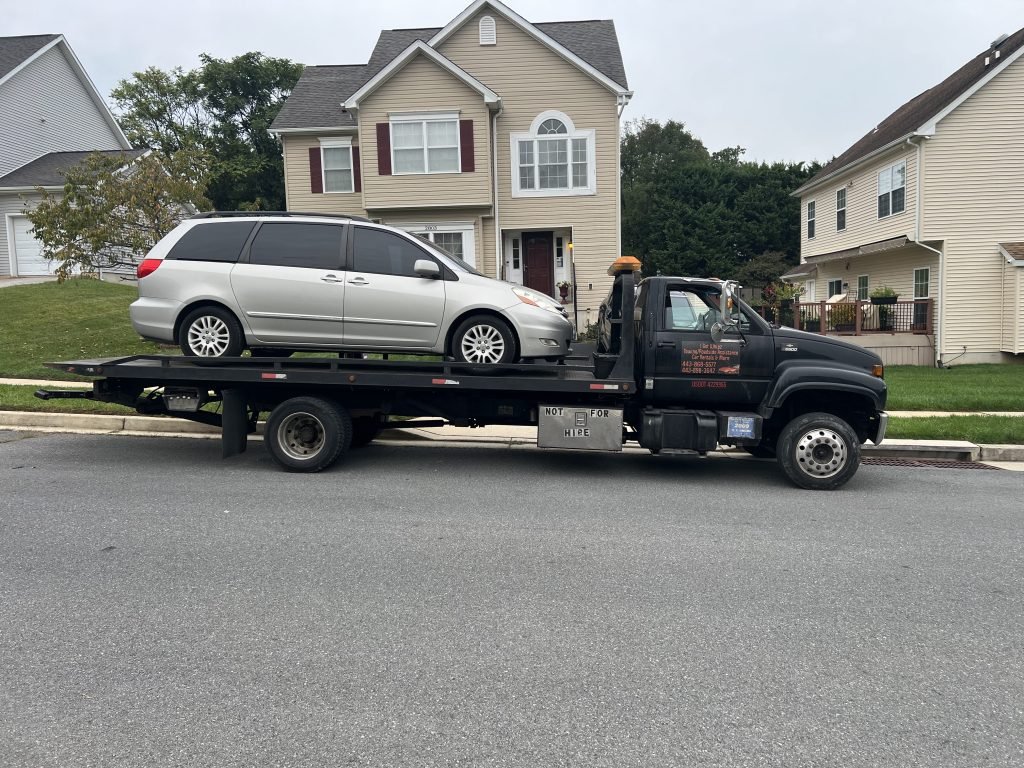 I Got Whipz Towing & Roadside Assistance with a beige toyota sienna van towing near me from 2400 Poplar Dr, Woodlawn, MD 21207 to 4898 Eleanora Ave, Baltimore, MD 21215