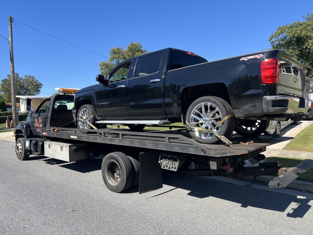 I Got Whipz Towing & Roadside Assistance with a blk chevy silverado truck towing near me from 3412 Milford mill rd Windsor Mill MD, 21244 to 4130 Emmart ave Baltimore, MD 21215