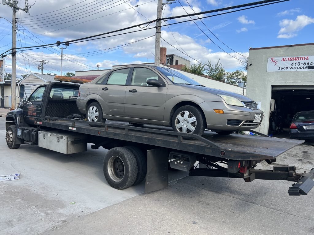 I Got Whipz Towing & Roadside Assistance with a beige ford focus sedan towing near me from I Got Whipz Towing & Roadside Assistance with a blk honda accord sedan towing near me from 3001 Wayne Ave, Gwynn Oak, MD 21207 to 3609 Woodland Ave, Baltimore, MD 21215 to 5006 Liberty Heights Ave, Gwynn Oak, MD 21207