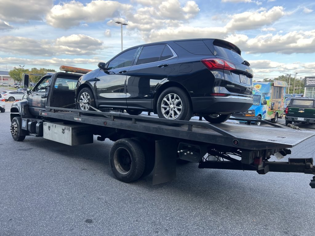 I Got Whipz Towing & Roadside Assistance with a black chevy equinox suv towing near me from 6633 Security Blvd, Woodlawn, MD 21207 to Mollye Rd, Pikesville, MD 21208