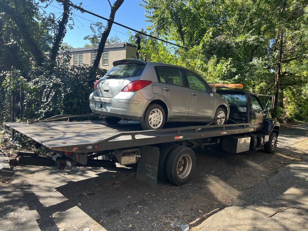 I Got Whipz Towing & Roadside Assistance with a grey nissan versa hatchback towing near me from 214 harlem ln catonsville, MD 21228 to 6126 Northdale Rd, Catonsville, MD 21228