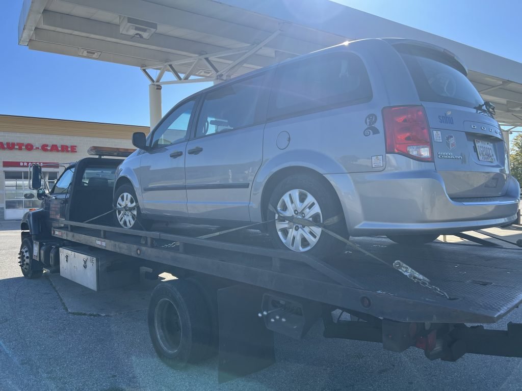I Got Whipz Towing & Roadside Assistance with a grey dodge caravan towing near me from 1117 N Rolling Rd, Baltimore, MD 21228 to 1515 Old Eastern Ave, Essex, MD 21221