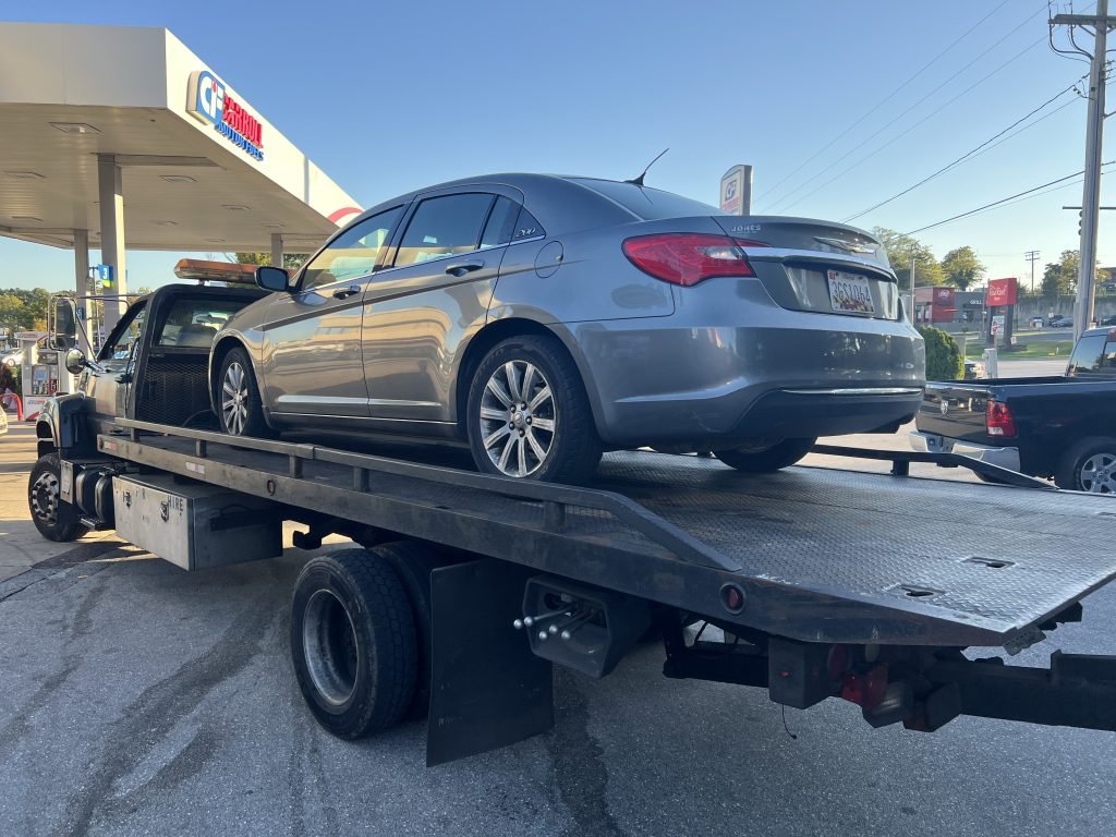 I Got Whipz Towing & Roadside Assistance with a grey chrysler 300 sedan towing near me from 6698 Security Blvd, Woodlawn, MD 21207 to 3103 Windsor Blvd, Baltimore, MD 21207