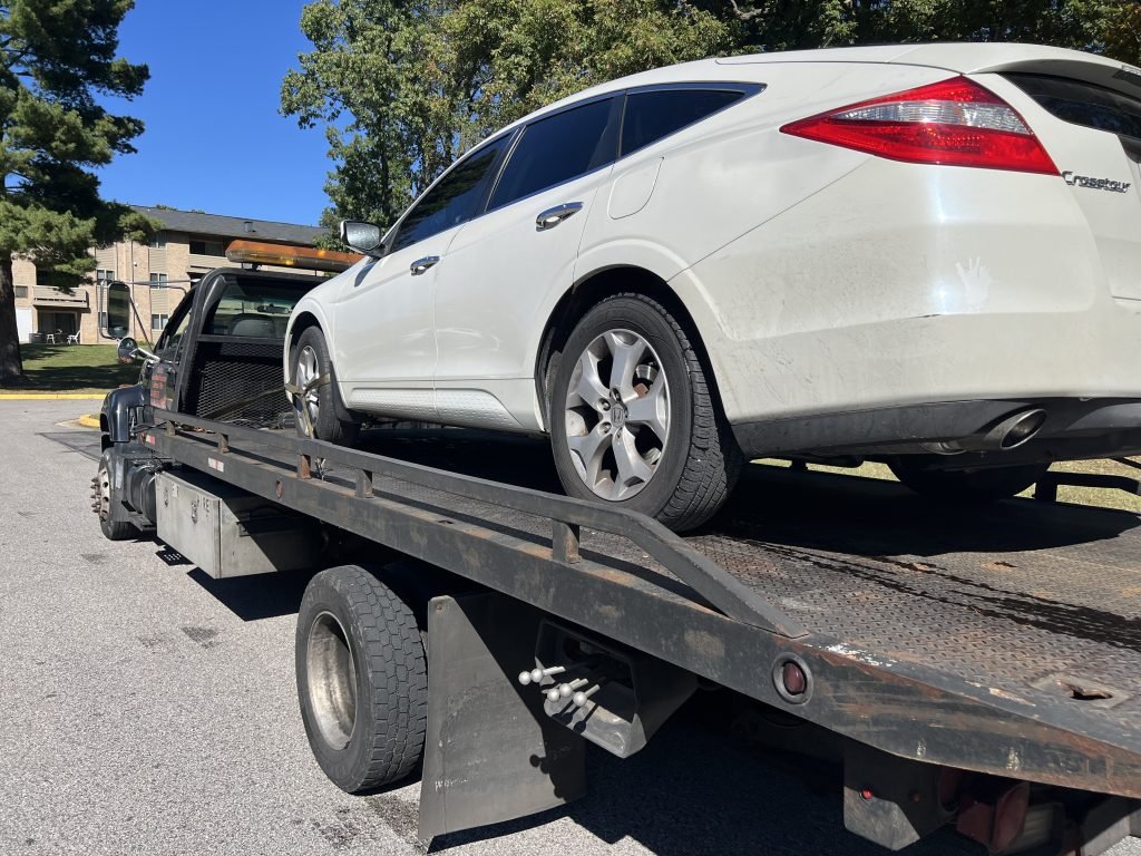 I Got Whipz Towing & Roadside Assistance with a white honda crosstour suv towing near me from 2 cedar heights ct Lochearn, MD 21207 to 1801 Ramsay St, Baltimore, MD 21223