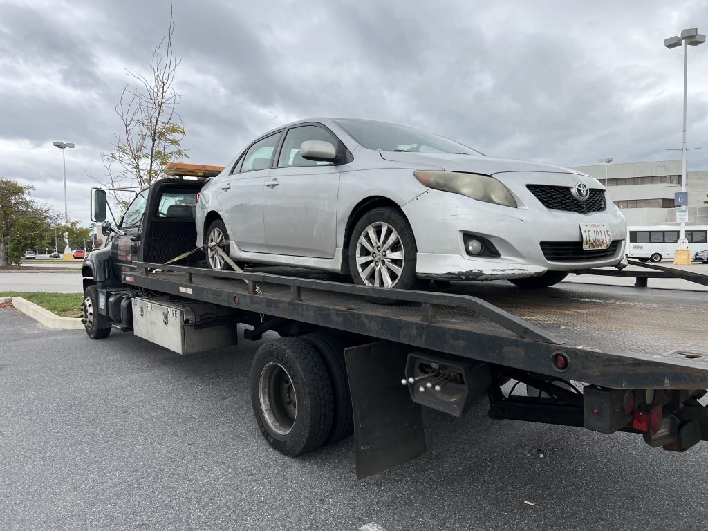 I Got Whipz Towing & Roadside Assistance with a grey toyota corolla sedan towing near me from 6901 Security Blvd Ste 871, Baltimore, MD 21244 to 8700 Church Ln, Randallstown, MD 21133