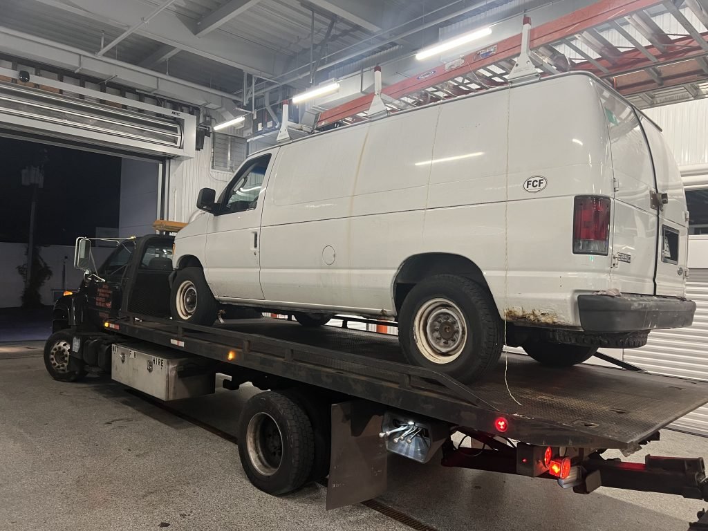 I Got Whipz Towing & Roadside Assistance with a white ford e350 van towing near me from 1807 Whitehead Rd, Woodlawn, MD 21207 to 1506 Woodlawn Dr, Woodlawn, MD 21207