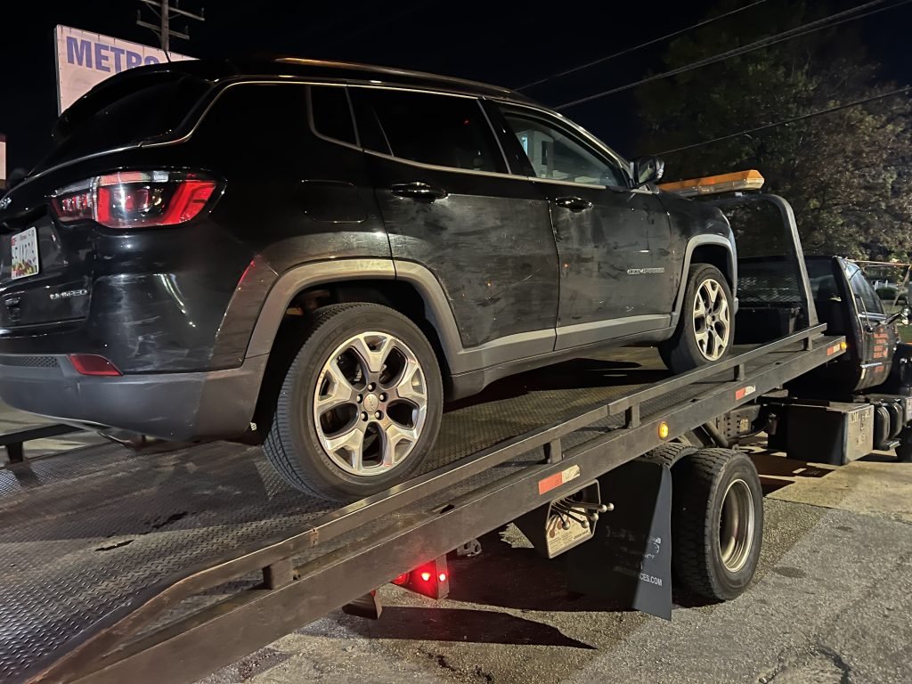 I Got Whipz Towing & Roadside Assistance with a black jeep compass towing near me from 39.192044, -76.771639 to 2800 Wilkens Ave Baltimore, MD 21229