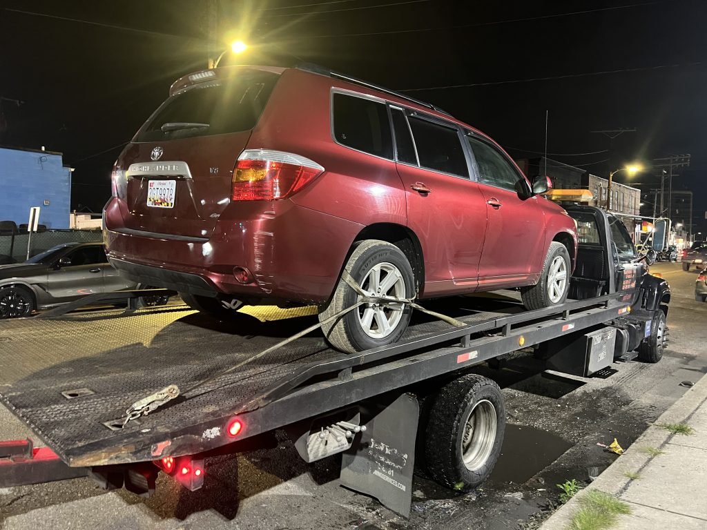 I Got Whipz Towing & Roadside Assistance with a red toyota highlander towing near me from 3800 Washington Ave, Windsor Mill, MD 21244 to 4107 W Belvedere Ave, Baltimore, MD 21215