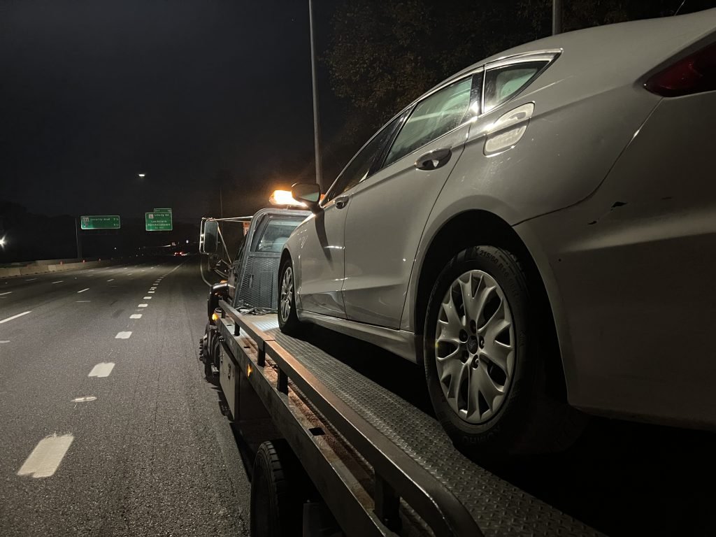 I Got Whipz Towing & Roadside Assistance with a white ford fusion towing near me from 39.36328, -76.74725 to 7204 Chippenham Pl, Windsor Mill, MD 21244