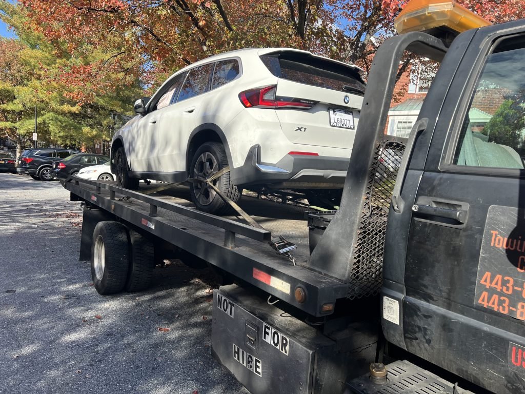 I Got Whipz Towing & Roadside Assistance with a white bmw x1 towing near me from 4907 Lockard Dr, Owings Mills, MD 21117 to 732 Peach Orchard Ln, Dundalk, MD 21222