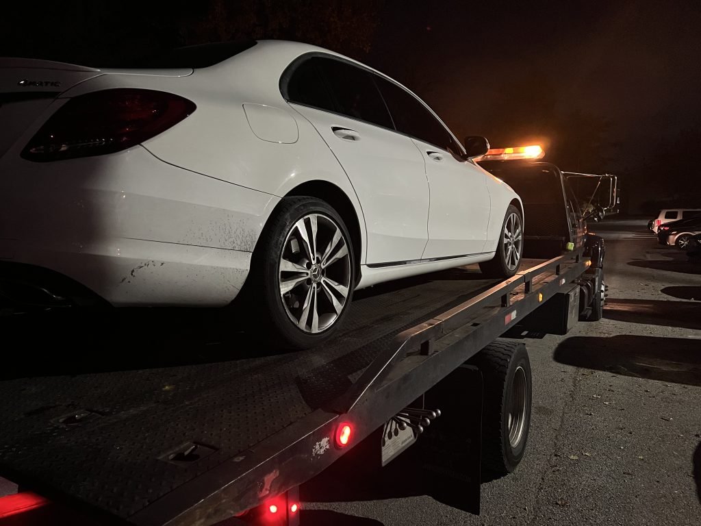 I Got Whipz Towing & Roadside Assistance with a white mercedes-benz c300 sedan towing near me from 21 Tentmill Ln, Baltimore, MD 21208 to 2809 Gresham Way, Windsor Mill, MD 21244