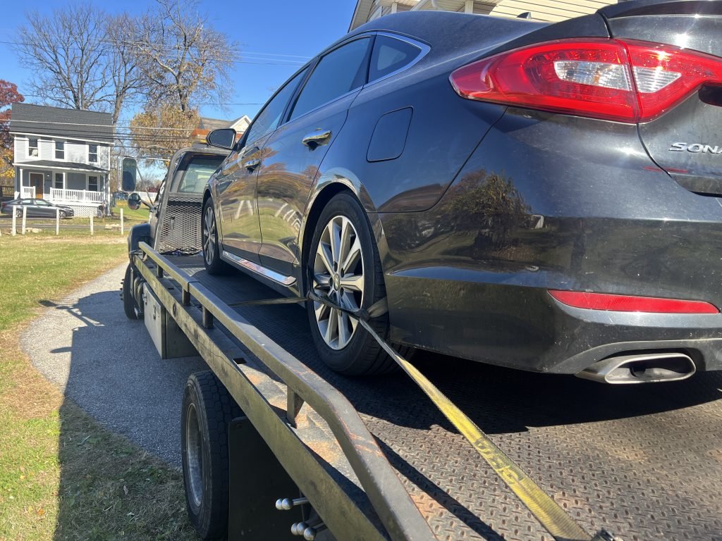 I Got Whipz Towing & Roadside Assistance with a black hyundai sonata sedan towing near me from 7006 Windsor Mill Rd, Baltimore, MD 21207 to 6301 Luers Ln, Sykesville, MD 21784