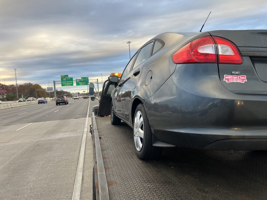 I Got Whipz Towing & Roadside Assistance with a grey ford se sedan towing near me from 39.26880,-76.66053 to 9801 Pulaski Hwy, Middle River, MD 21220