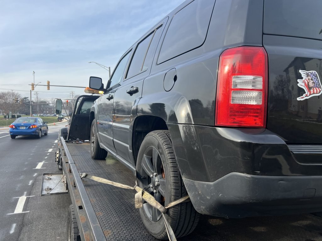 I Got Whipz Towing & Roadside Assistance with a black jeep patriot truck towing near me from 6229 free stone ct Columbia, MD 21044 to 6440 Freetown rd Columbia, MD 21044