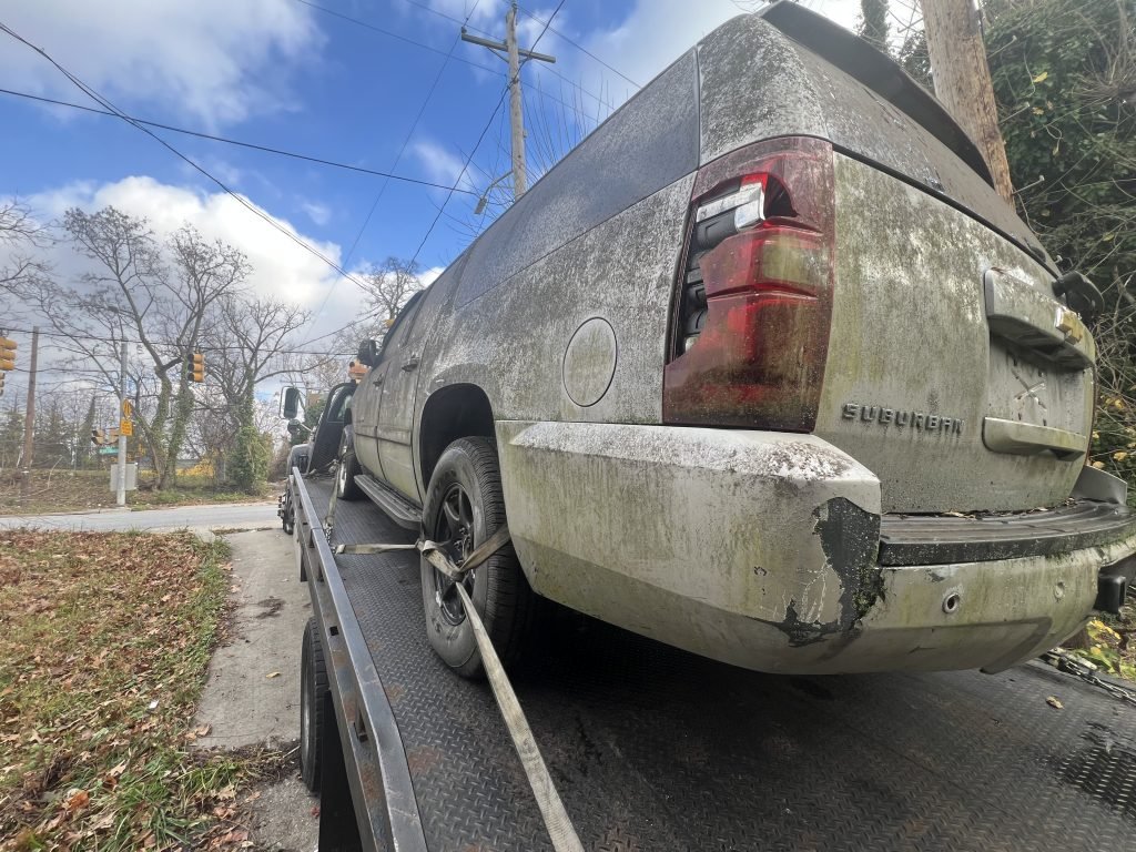 I Got Whipz Towing & Roadside Assistance with a silver chevy suburban truck towing near me from 3300 Walbrook AveBaltimore, MD 21216 to 4200 Ridge Rd, Nottingham, MD 21236