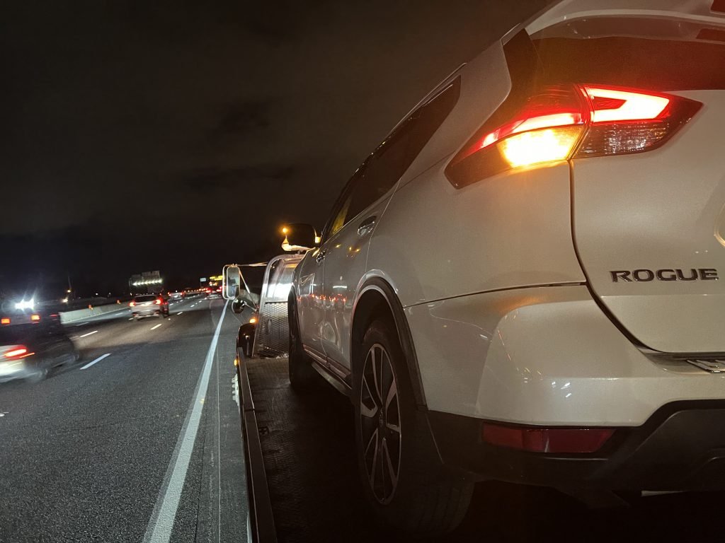 I Got Whipz Towing & Roadside Assistance with a white nissan rogue suv towing near me from 39.357054, -76.746412 to 9698 Southall Rd, Randallstown, MD 21133