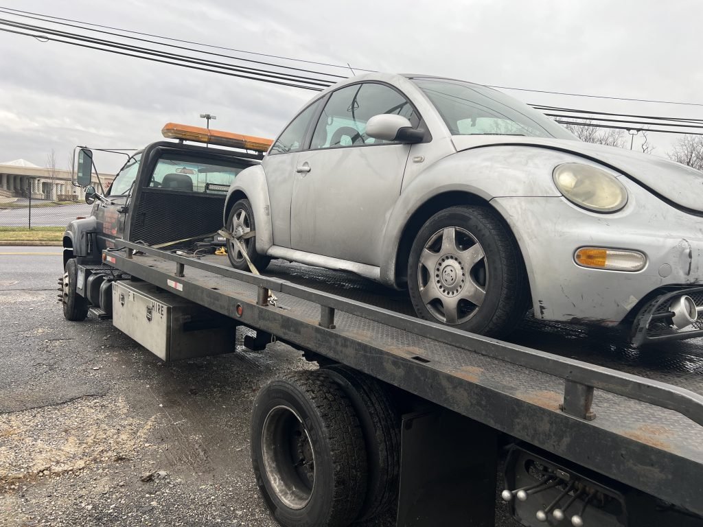 I Got Whipz Towing & Roadside Assistance with a grey Volkswagen coupe towing near me from 6810 Dogwood Rd Windsor Mill, MD 21244 to 1010 Leslie Ave, Catonsville, MD 21228
