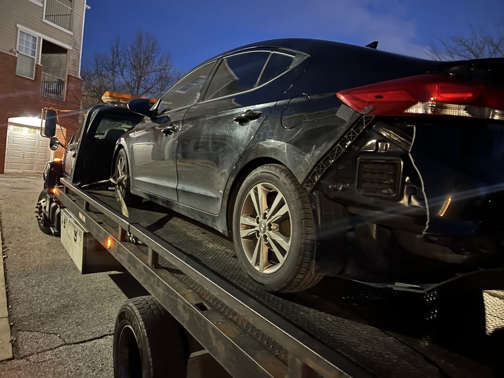 I Got Whipz Towing & Roadside Assistance with a black hyundai elantra towing near me from Bogley Rd, Windsor Mill, MD 21244 to 5820 Oakleaf Ave, Baltimore, MD 21215