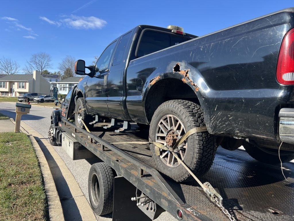 I Got Whipz Towing & Roadside Assistance with a black ford F250 truck towing near me from 2220 Lawnwood cir Gwynn Oak, MD 21207 to 6600 Baltimore National Pike, Baltimore, MD 21228